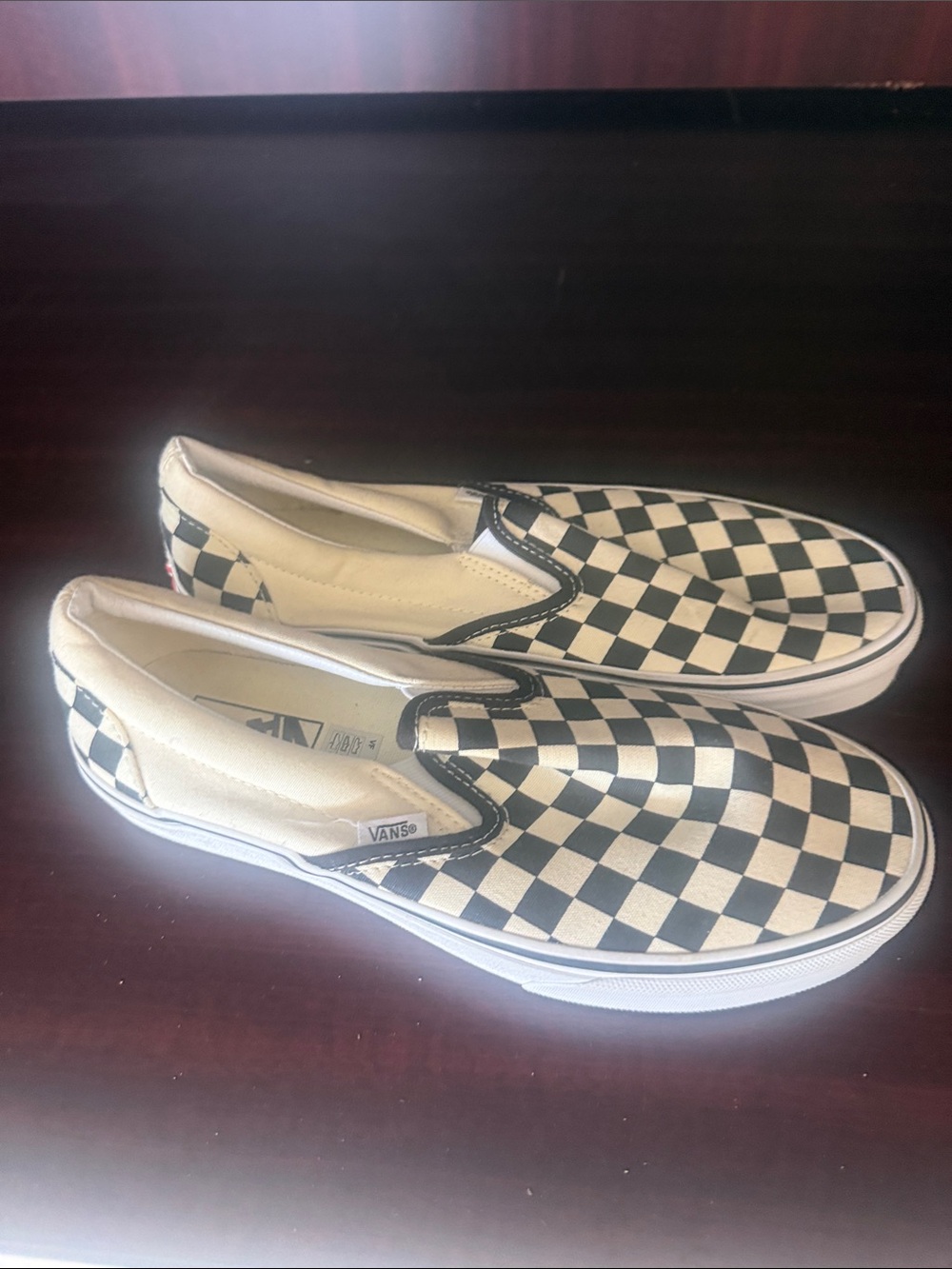 Vans Black and White Checkerboard Slip-On Sneakers